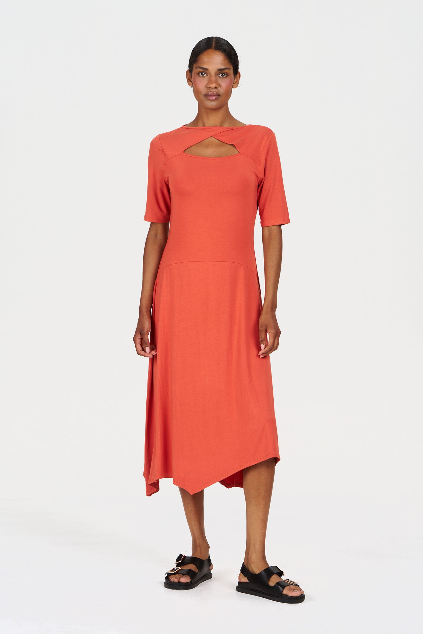 PIP Modal Dress - Orange displayed on a model, featuring a unique cutout neckline and modern design.