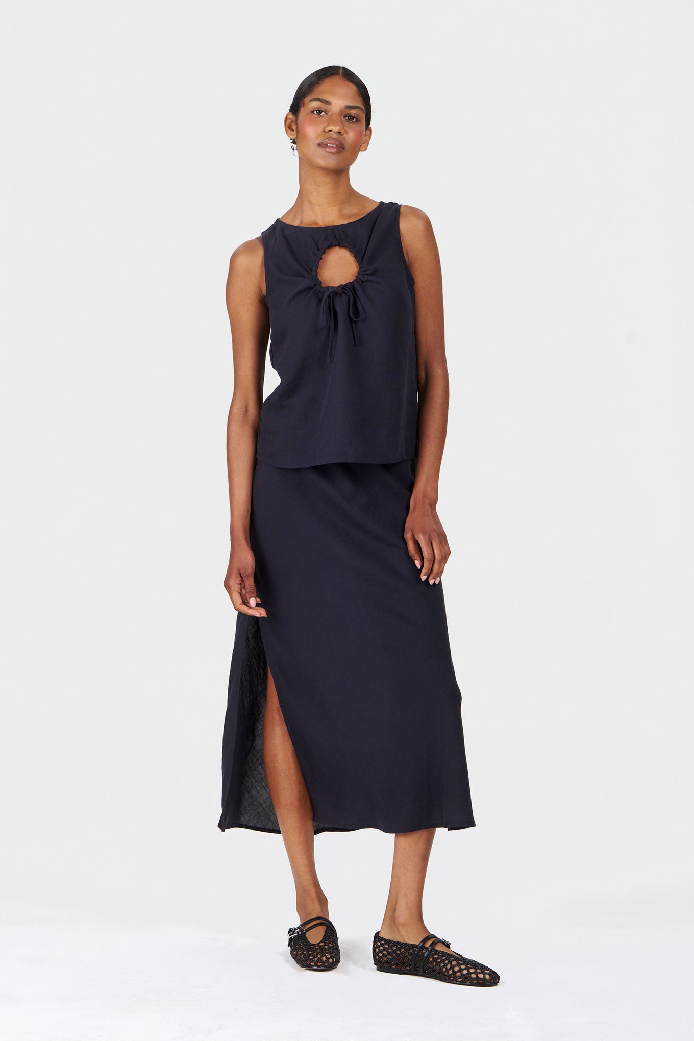 Model wearing ZIZI Tencel Linen Top - Navy with a stylish skirt, showcasing a relaxed everyday look.