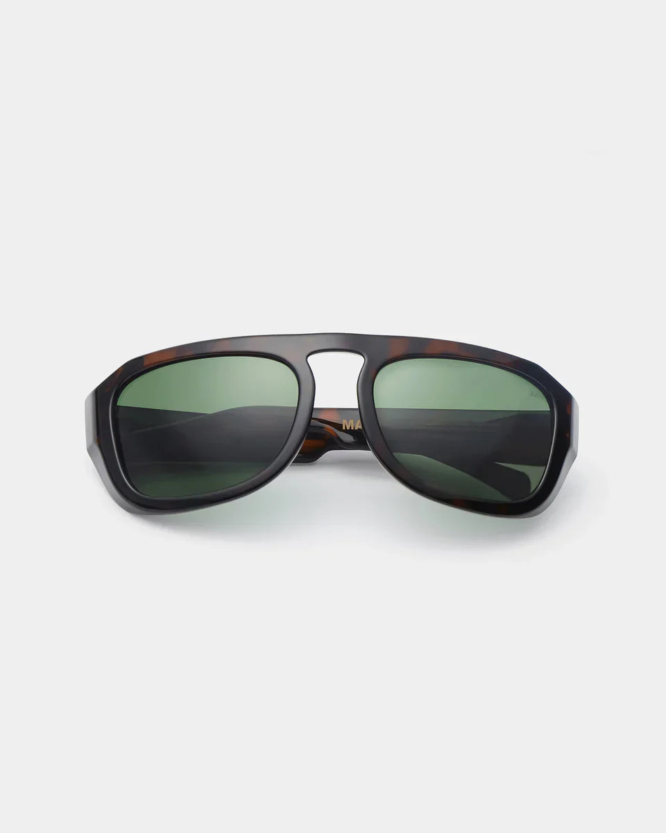 MAX - Demi Tortoise Sunglasses by A.Kjaerbede on a plain background, showcasing a unique retro-inspired design.