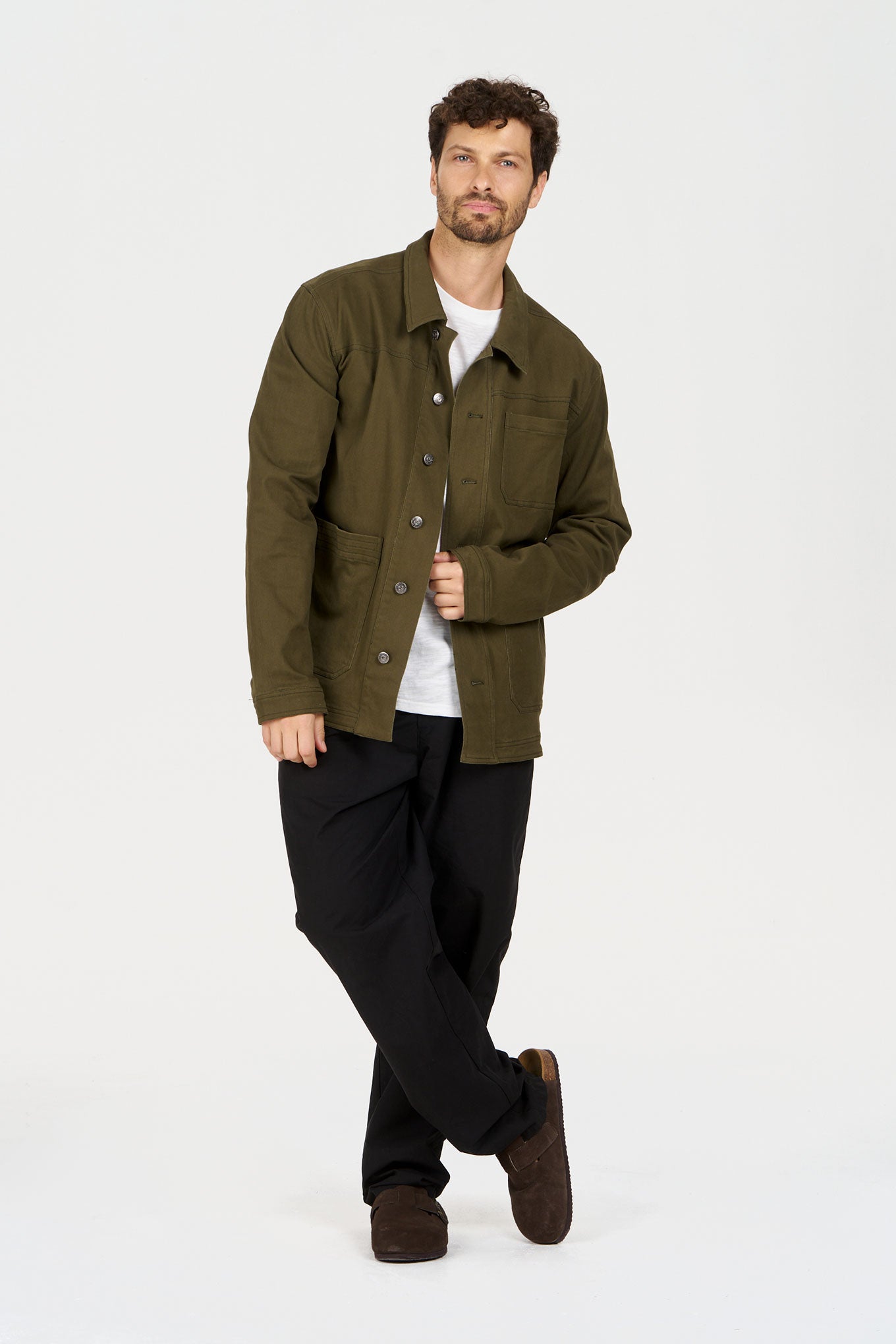 Man wearing CHRISTOPHE Jacket - Green made of organic cotton and spandex, showcasing a relaxed fit and subtle stretch.
