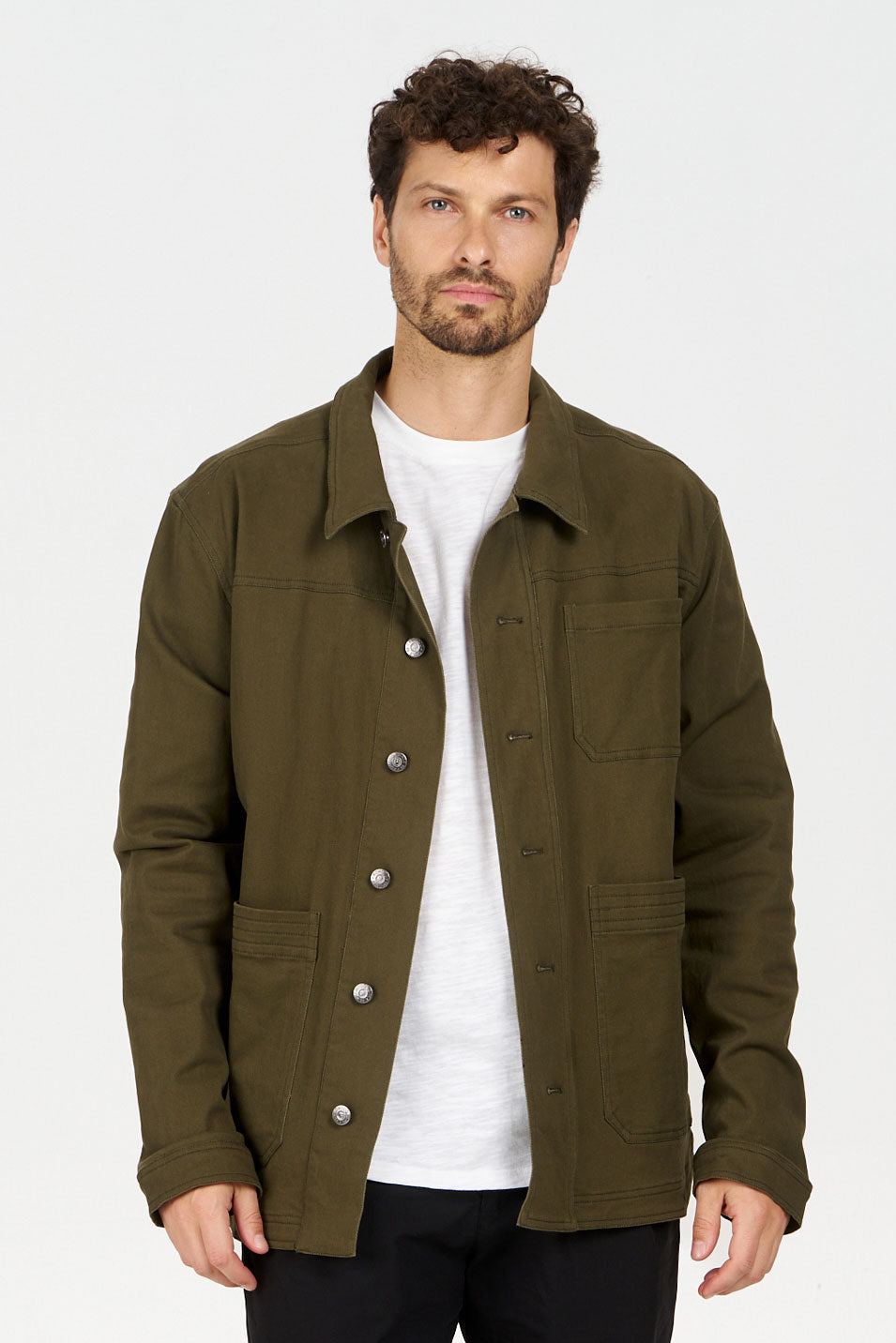Man wearing CHRISTOPHE Jacket - Green, made of organic cotton with a loose fit, perfect for layering.
