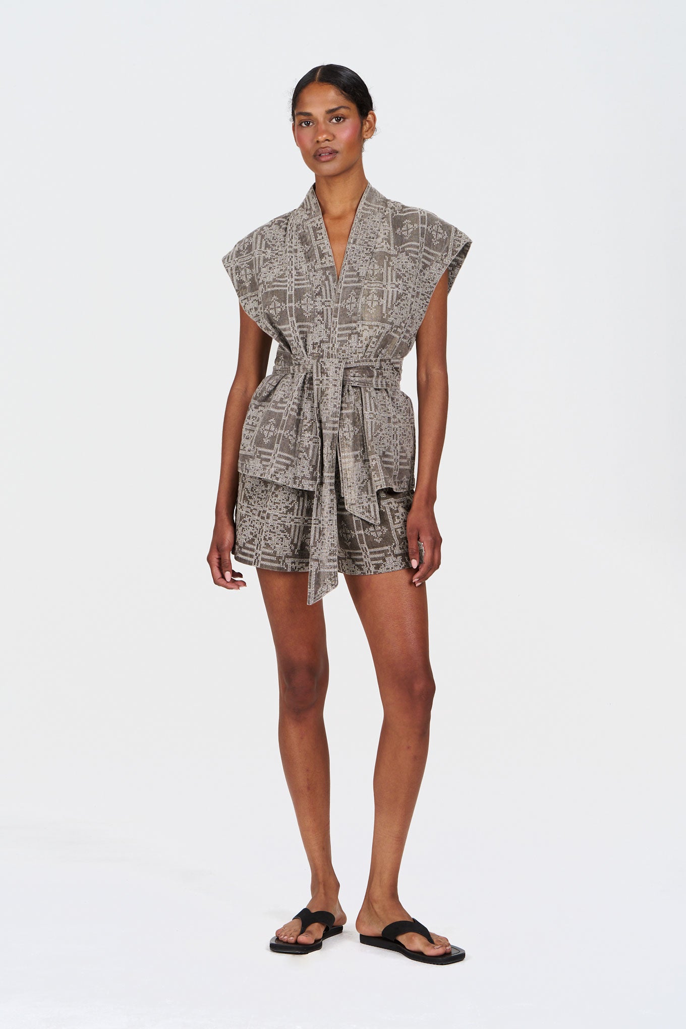 GEORGIE Organic Linen Cotton Gilet -  Mushroom Crossstich worn by a model, showcasing its lightweight and stylish design.