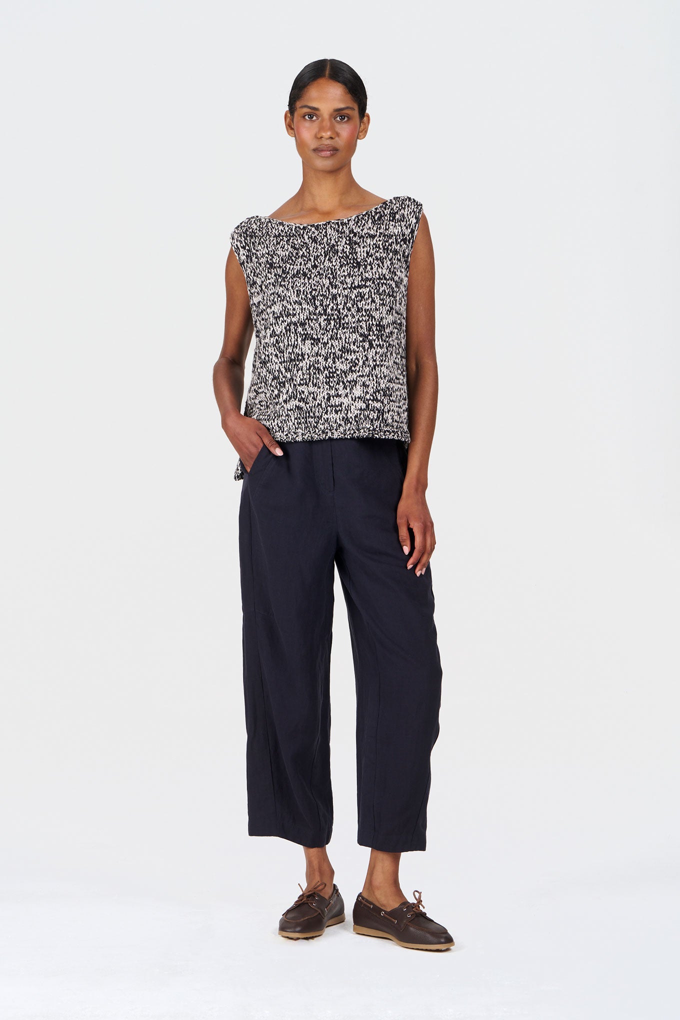 Model wearing KALA Organic Cotton Vest - Black & White paired with stylish wide-leg pants.