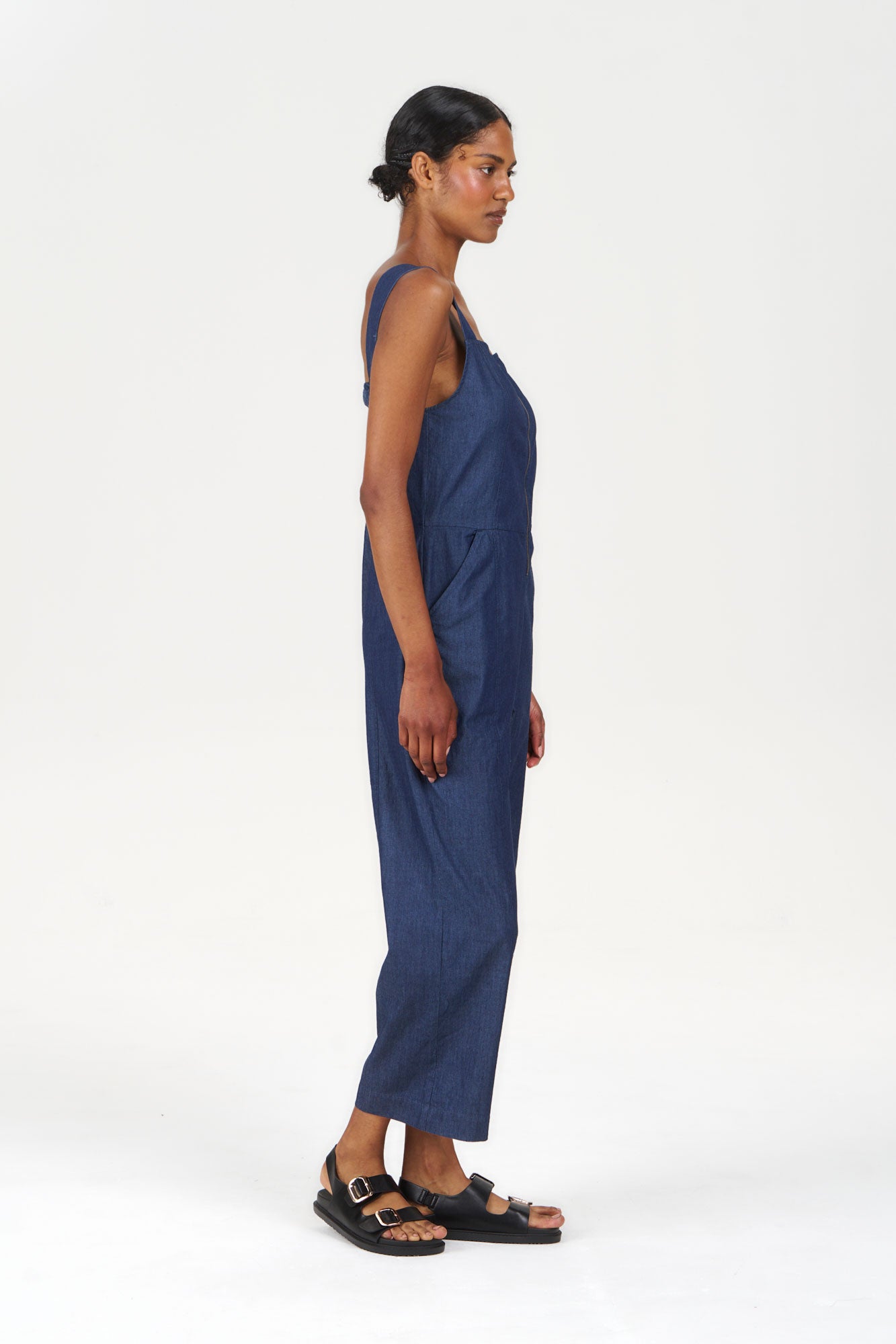 DAY Organic Cotton Jumpsuit - midwash worn by model in a side view showcasing its stylish design.