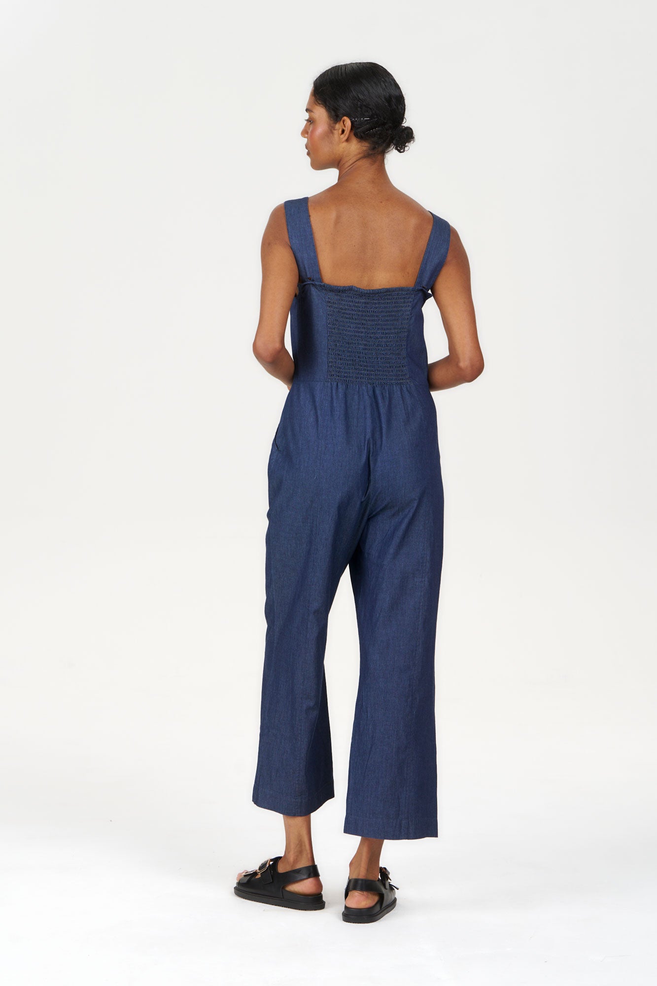 DAY Organic Cotton Jumpsuit - midwash, back view showing straps and relaxed fit, made with 100% organic cotton.