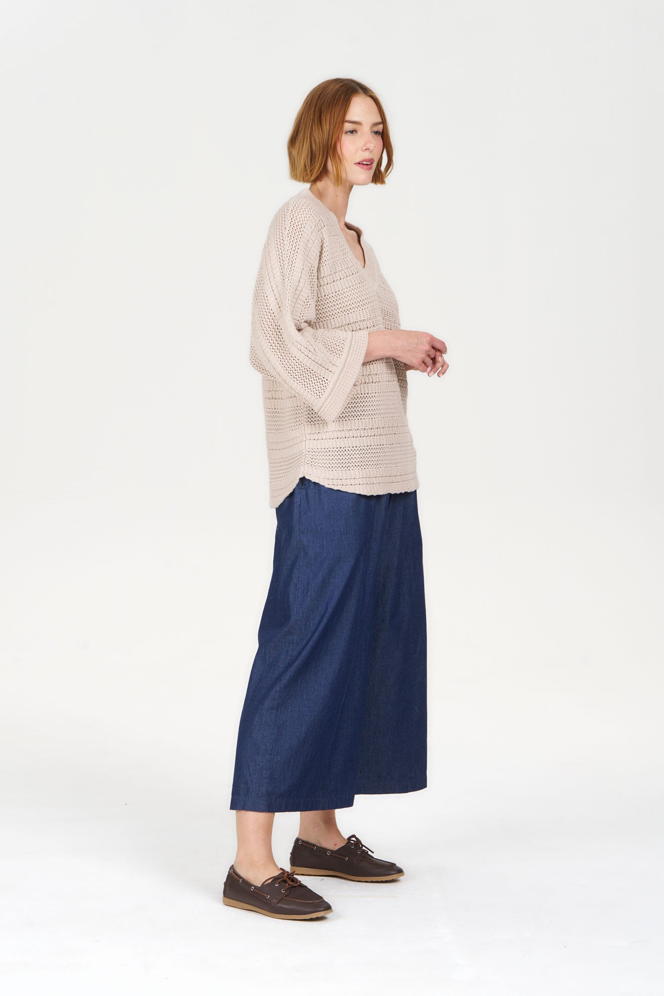 COLADA Organic Cotton Tee - Sand worn by a model with a casual outfit featuring a flowy design and a relaxed fit.