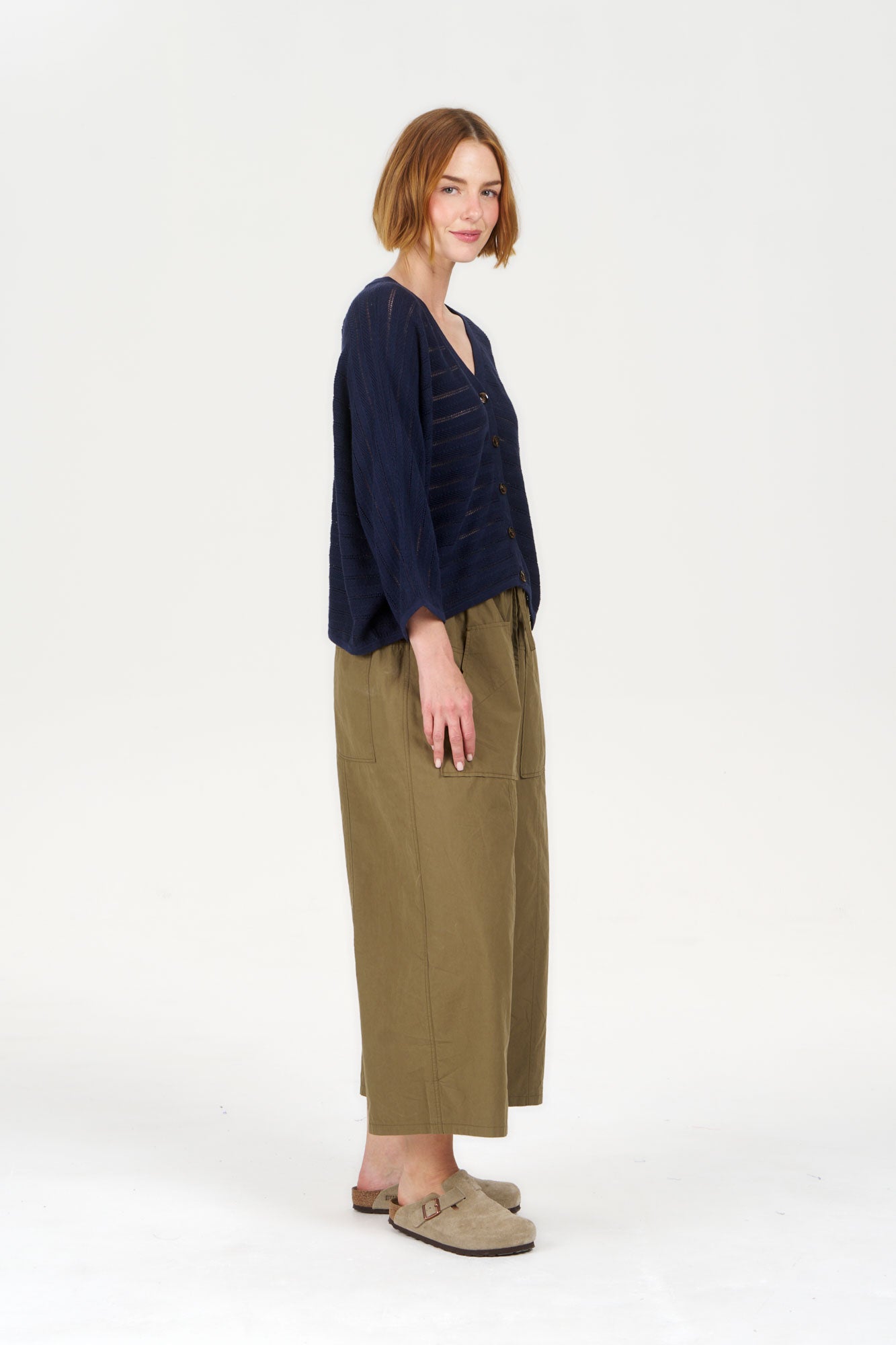Model wearing CLEO Organic Cotton Trouser - Khaki with a navy top and casual footwear.
