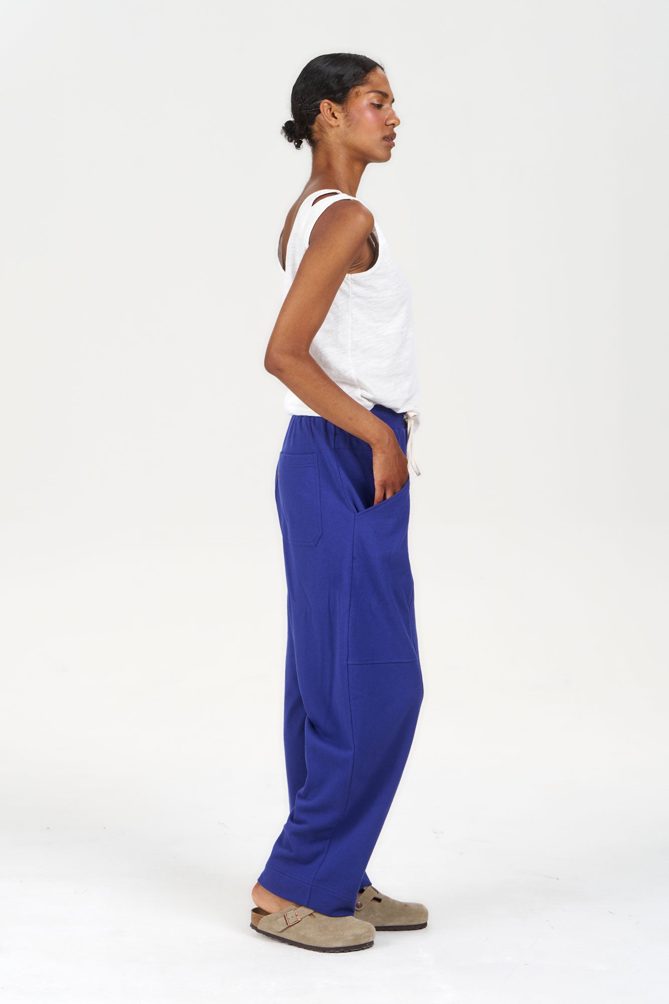 Model wearing MARA Organic Cotton Jogger - Blue with a white tank top, showcasing the eco-friendly design.
