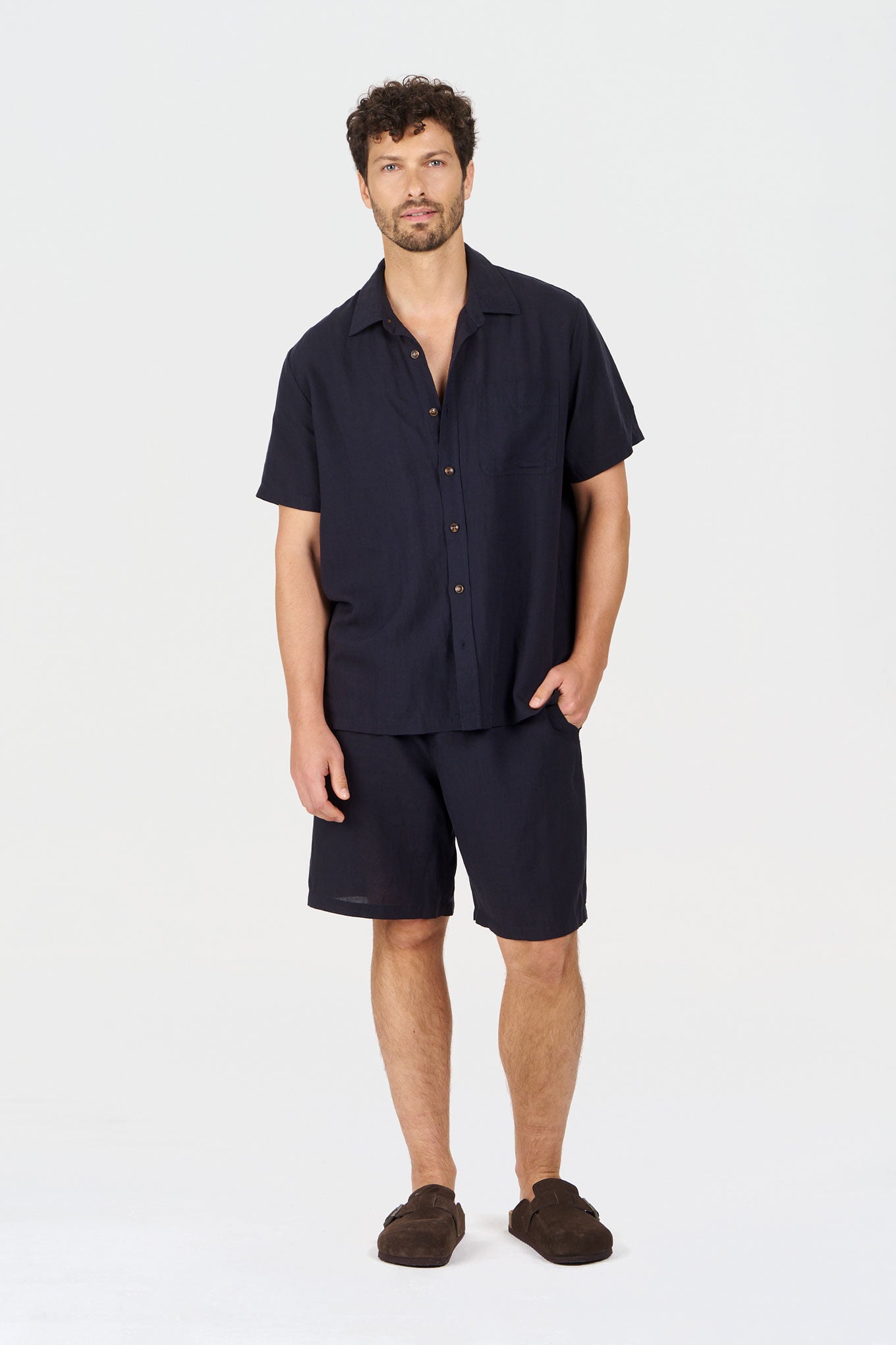 LOYLE Tencel Linen Shirt - Navy worn by a model with shorts, showcasing a relaxed fit and summer style.