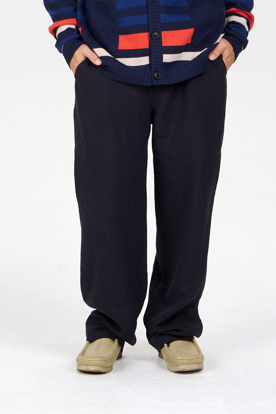 MAKULU Tencel Linen Trouser - Navy displayed on a model, showcasing a loose fit and lightweight fabric.