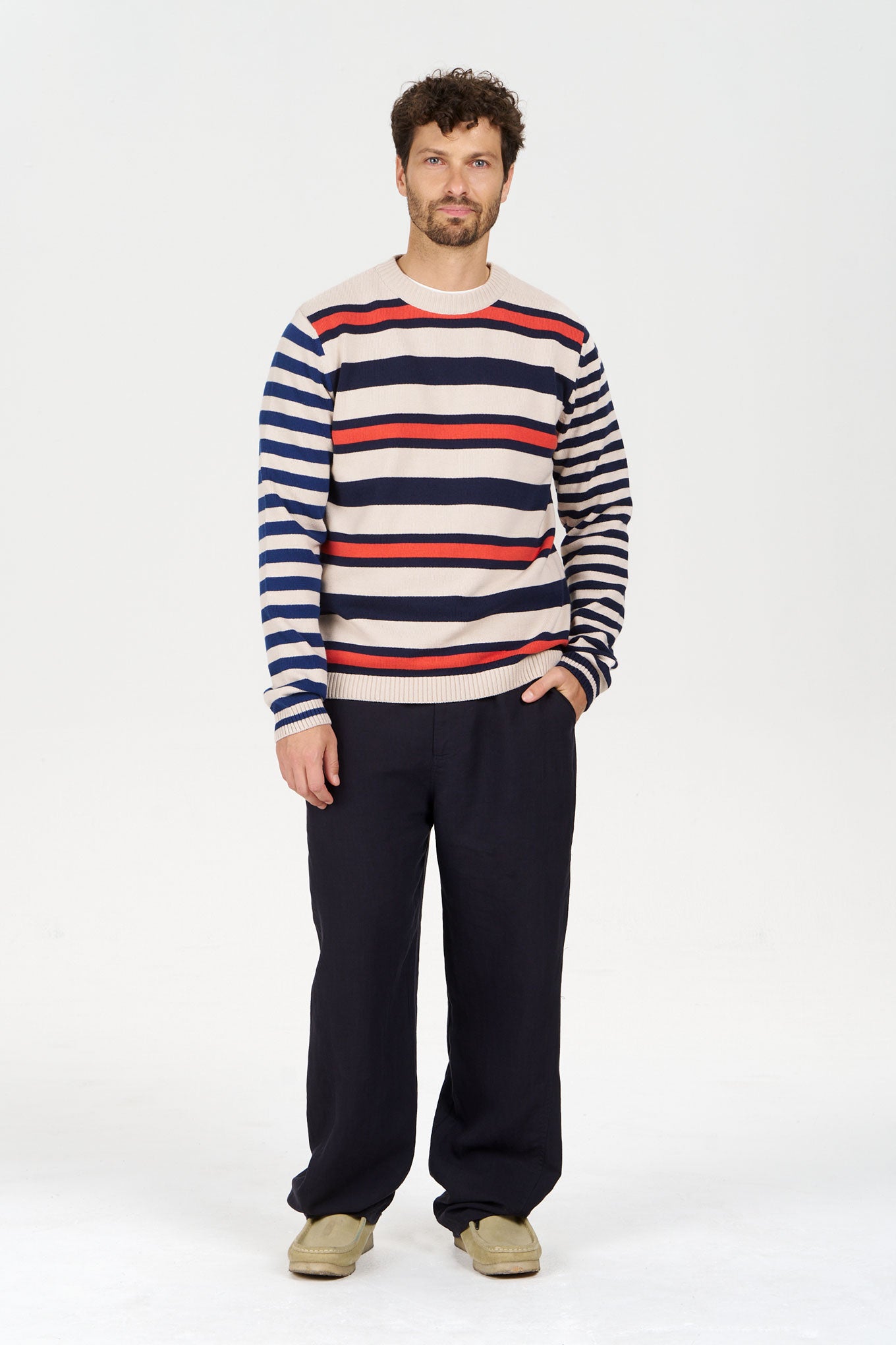 MASH UP Organic Cotton Jumper worn by a man with a striped design, paired with dark pants, on a neutral background.