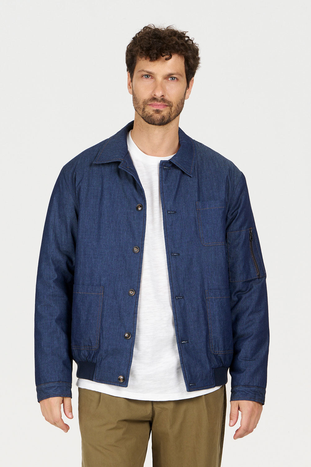 NILE Organic Cotton Chambray Jacket - Mid Wash on model, showcasing a stylish denim look with a comfortable fit.