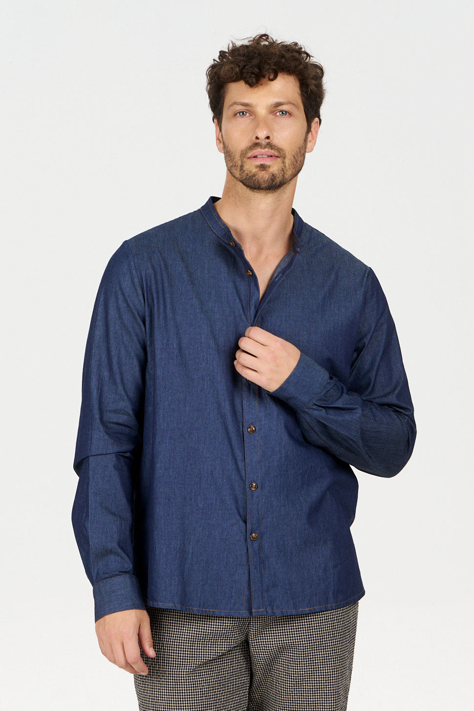 Model wearing ROBBIE Organic Cotton Chambray Shirt, a loose fit shirt with a denim look in organic cotton.