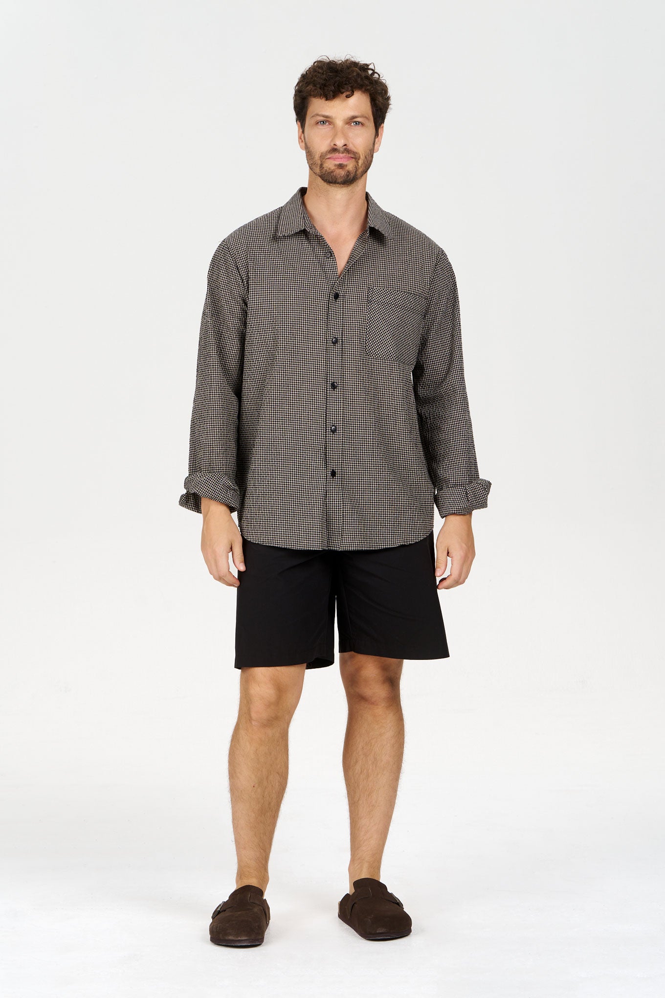 SPECTRE Organic Cotton Shirt - Check worn by a model, featuring a checkered design and loose fit.
