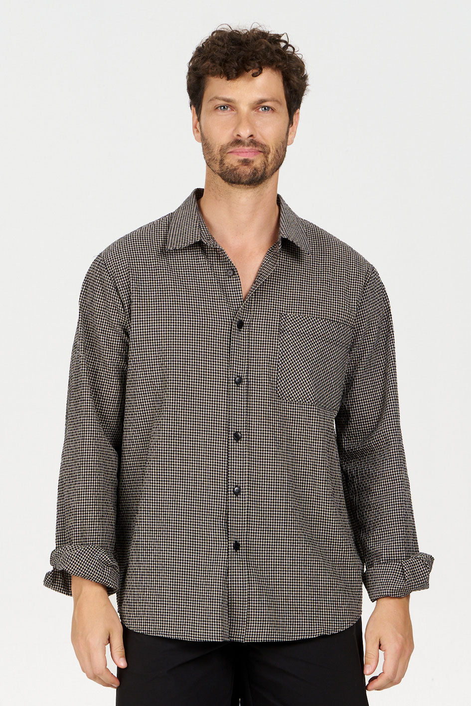 SPECTRE Organic Cotton Shirt - Check displayed on a model, featuring a checkered pattern and loose fit.